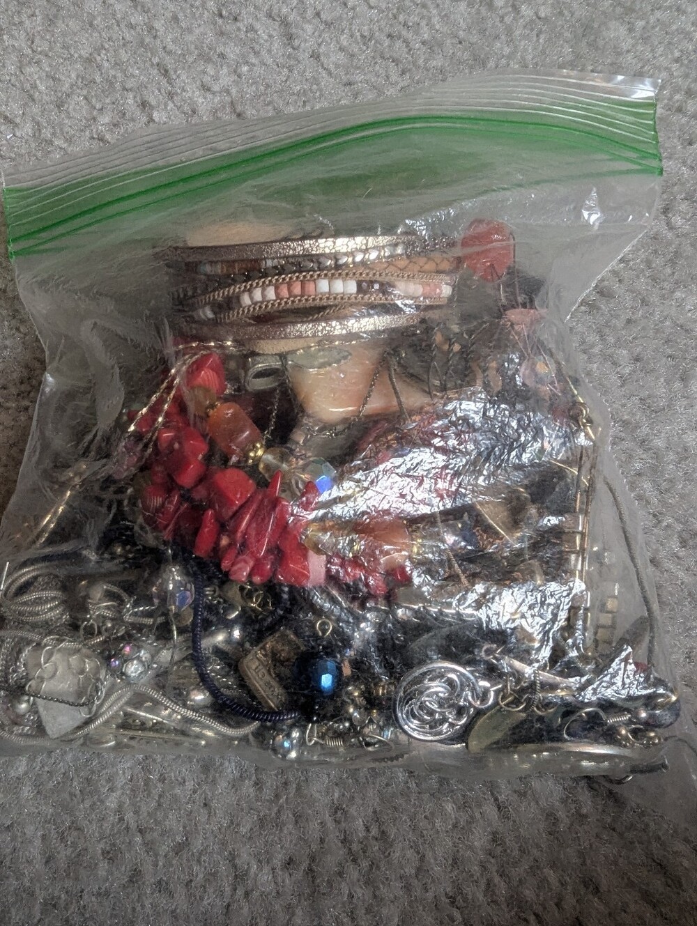 Bag of jewelry (earrings, necklaces, etc)
